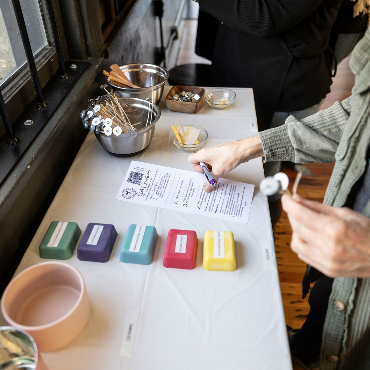 A candle making class set up in-store in Tenino
