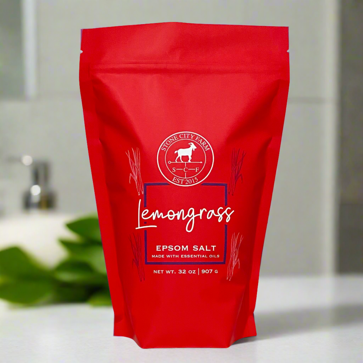 Lemongrass Epsom bath salts in a 2 lb red pouch on a bathroom counter
